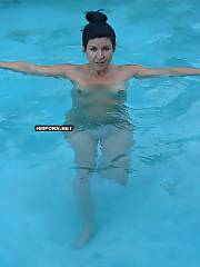 Mature black haired mamma sunbathing nude or wearing a sexy swimsuit and showing her sexy nude body at the pool or swimming in it