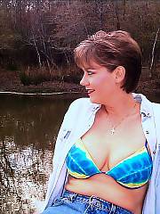 My sexy wife posing - my sexy wife exposing off her hot body for me at our cottage by the lake.  she enjoys to keep me hard and happy and that she does!!!!