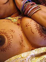 Indian wifey takes a cum shot on her body.  hot body covered in tattoos.  had some big butt nipples too