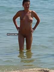 Girl nudist and naturist chicks and women taking sun baths on the public beaches worldwide and get pictured by friends and voyeurists