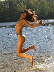 Nudist and naturist babes jumping naked on the beach and spreading legs in the air flashing their sweet pussies