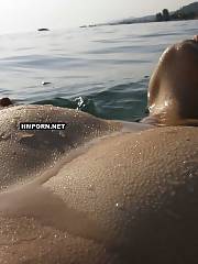 Tanned lady with hard nips and cute shaved vagina swimming in the ocean and flashing her goods from underwater