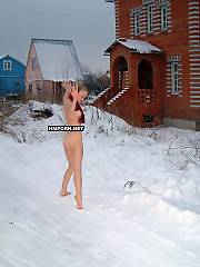 Insane girl walking naked outside in winter and laying on the snow-covered road showing her hot body and naked cunt and backside