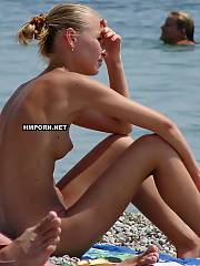 Nudist and naturist nymphs sunbathing nude on the beach and swimming nude in the sea, Very hot voyeur beach nymphs photos