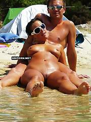 Nudist couples sunbathing nude on the beaches worldwide