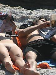 Nudist couples sunbathing nude on the beaches worldwide