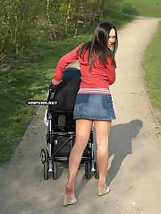 Beautiful brunette young MILF walking in the streets and public places with no panties upskirt, see how she flashes her puffy lipped twat