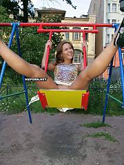Lovely nymph sitting on swings and flashing lovely pussy, Then she walks around and and exposing breathtaking exciting views of nude twat upskirt