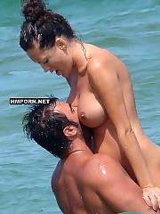 Hot nymphs caught sunbathing topless on the beach - voyeur amateur photos