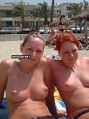 Nudist and naturist chicks and middle-aged women walking nude on the beach and sunbathing with no panties or bra in public, watch their sweet vaginas between wide spreaded legs