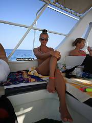 Lovely girlfriend loving vacation days with her boyfriend, watch her sunbathing on the yachtt and exposing striptease in waters of athlantic ocean