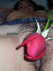 Unshaved vagina girlie got a red rose flower & let her vaginal flower be penetrated by naughty bf on these home made sex photos