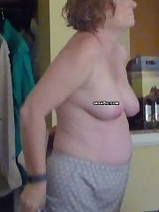 Curvy mature wife in hotel exposing her belly