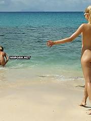 Nudist gals sunbathing on the beach and flashing pussies to strangers to tease them for a short romance and superb bang in the evening