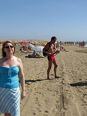 My mother showing off her body on the beach, shes not super fit but not super bbw either