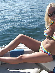 Sexy boobed blond showing breasts on the boat.