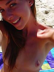 Outdoor amateur teen babe self shooting herself naked on a public beach.