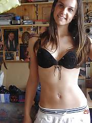 Beautiful young amateur girl stripteasing at home.