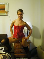 Sexy amateur teen with pierced nip wearing her red corset.