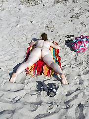 Mamma woman - huge and white ass - on the beach.