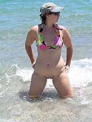 Fat twat on display at the beach, her huge body probably feels amazing