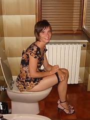 Mature peeing on toilet