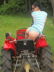 Farmers skinny wifey taking panties off at husbands tractor & exposing her impressive cunt from behind - amateur porn pics