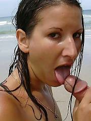 Horny girl giving a hot blow job at the beach.