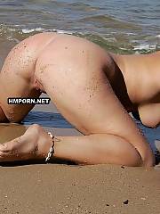 Amateur beach gals sunbathing nude on the world famous beaches and get filmed by nasty voyeurist men with big powerful pic cameras